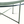 Green metal patio table side view with curved tabletop and diagonal cross brace