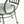 Green metal patio chair arm and circular seat frame with light gray cushion
