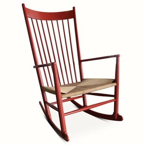 Red rocking chair angled view, slatted back and woven beige seat
