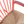 Rocking chair seat and slatted back detail, woven beige cushion on red frame