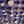 Close-up of purple peg art board with assorted light-wood circular pegs