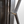 Bronze ring handle and metal hinge detail on faceted glass cabinet door
