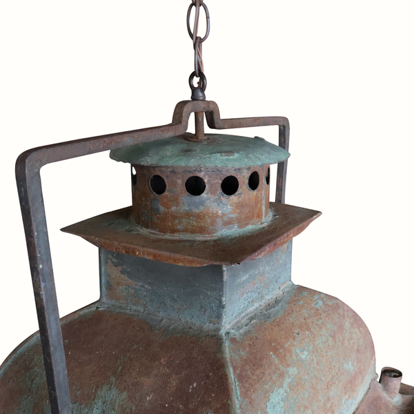 Hanging metal lantern top with green patina, perforated chimney, and side handle frame