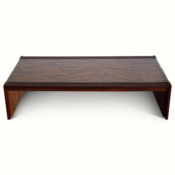 Low rectangular coffee table with dark top and angled wooden legs
