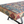 Kilim carpet bench seat detail with blue, red, and cream geometric woven pattern