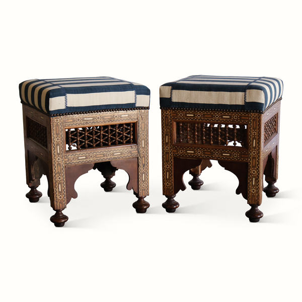 Pair of inlaid Moorish stools, front angle: striped tops with decorative metal trim
