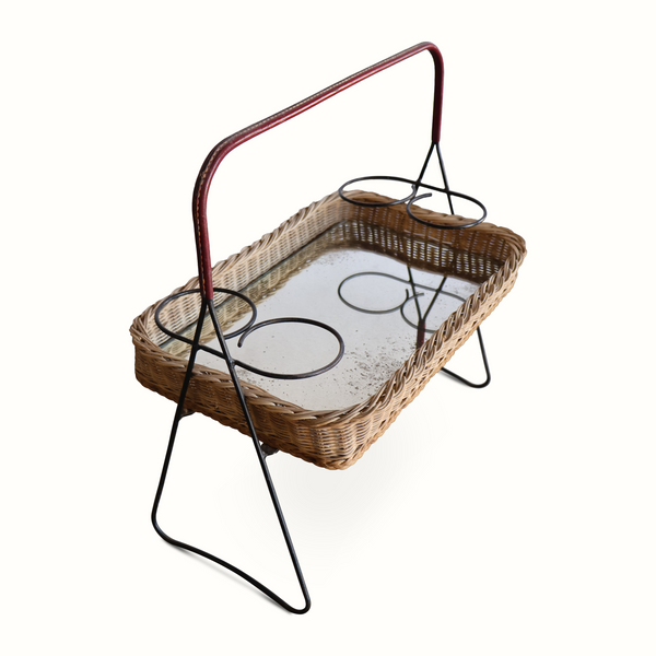 Wicker mirrored top tray table with black iron legs and circular mirror, dark red handle