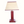 Red leather table lamp with beige fabric shade and dark trim, brass accents.