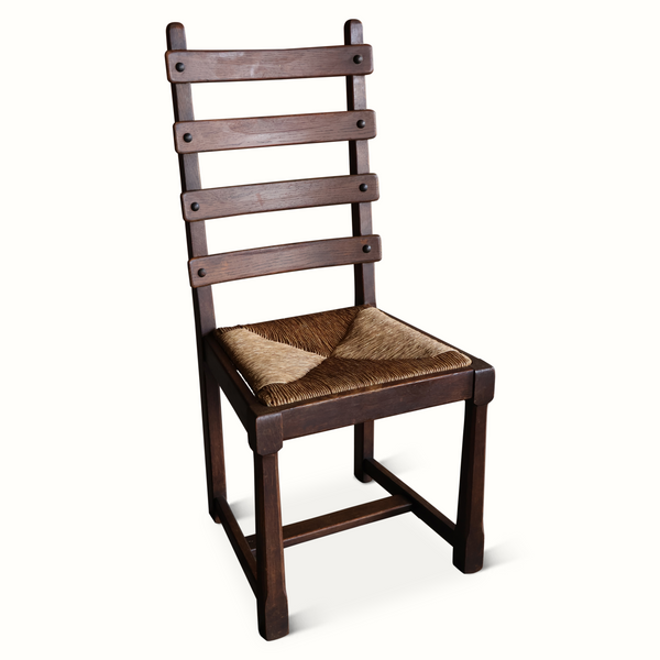 Oak ladderback chair with woven beige seat cushion and brown wood frame.