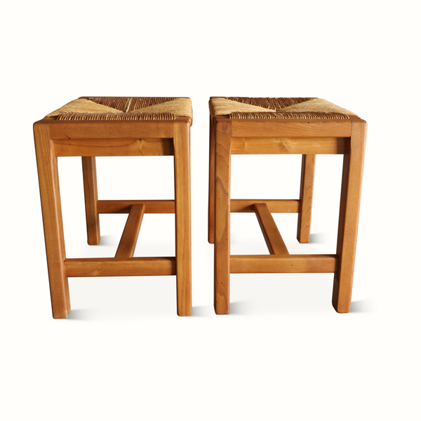 Two wooden stools with woven rush seats and open rectangular base frames