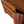 Walnut-finish dresser detail showing wood grain and open compartment edge
