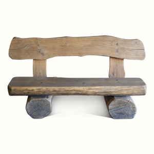 Live-edge wooden bench with thick seat and blue-stained log legs showing end grain