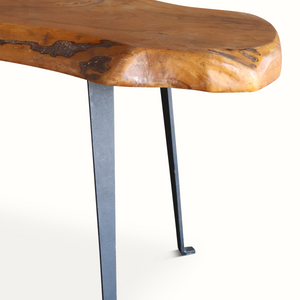Live edge wooden side table with natural knots on rounded corner and black metal legs