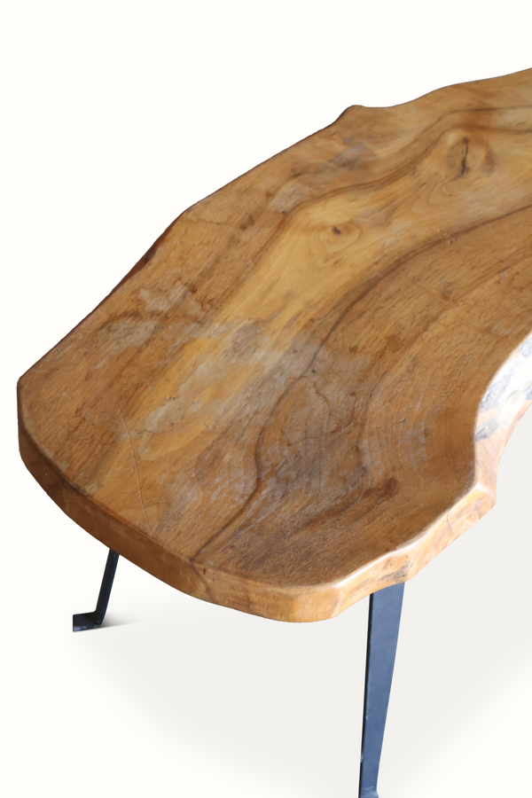 Live edge wooden table with smooth curved corner top and dark metal legs