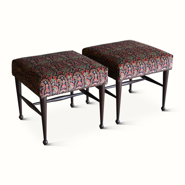 Upholstered stool pair with vintage Persian carpet-style fabric tops and dark wooden legs