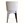 Back view of light upholstered leather accent chair with dark tapered legs