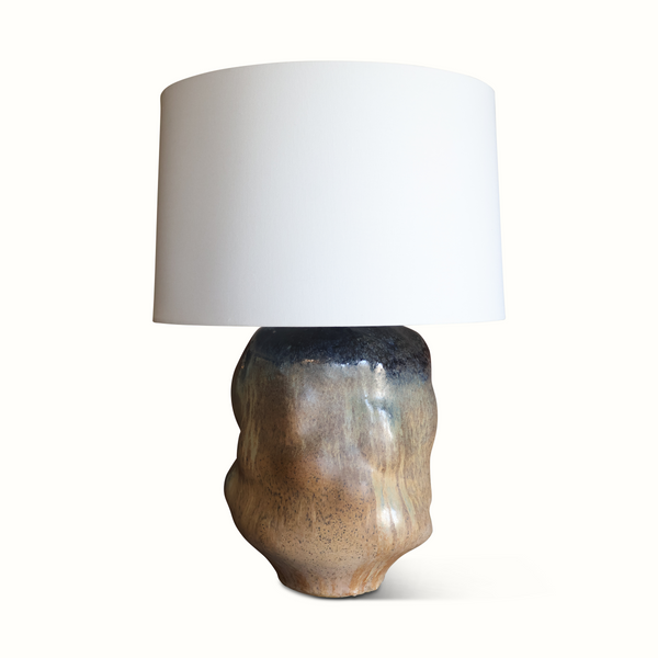 Brown glazed ceramic table lamp base with off-white drum shade