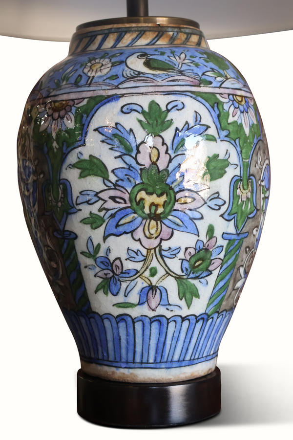 Blue and white floral ceramic vase table lamp with dark base and gold-toned neck
