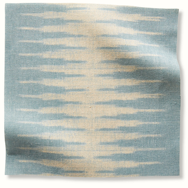 Ocean-blue ikat pillow fabric with light beige horizontal streaks