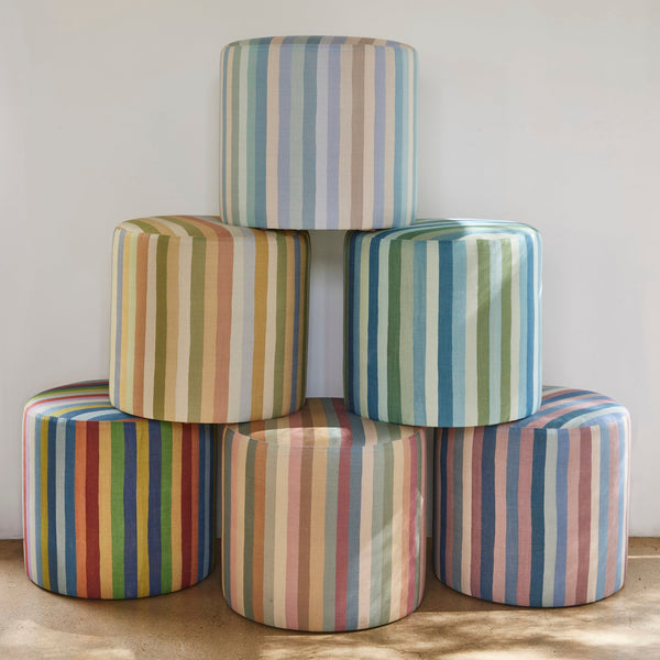 Multicolor striped indoor pouf set with six cylindrical ottomans