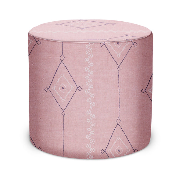 Round indoor pouf, pink upholstered fabric with navy geometric diamond pattern
