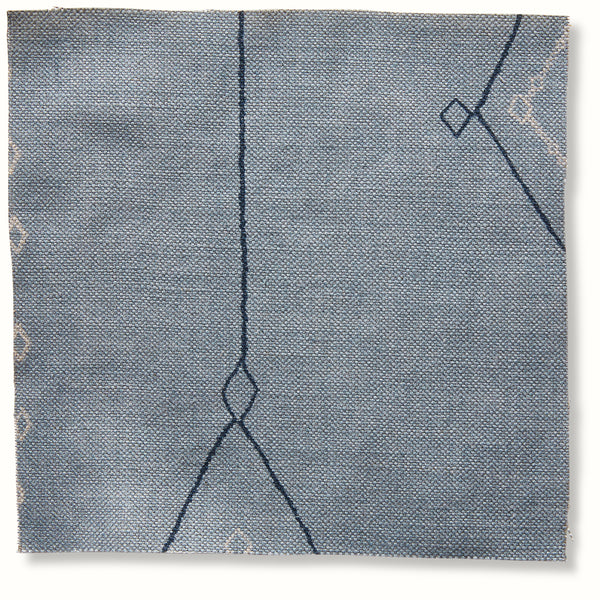 Blue textured pillow cover with diamond and line pattern