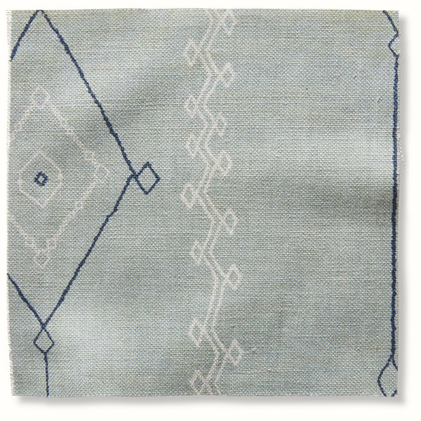 Ocean-blue decorative pillow fabric with navy geometric line pattern and border