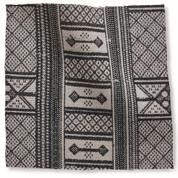 Outdoor Masai onyx pillow cover with black-and-white geometric stripe and motif panels