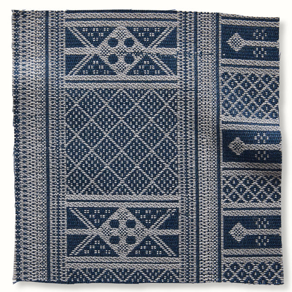 Outdoor decorative pillow cover with blue-and-white geometric tribal pattern