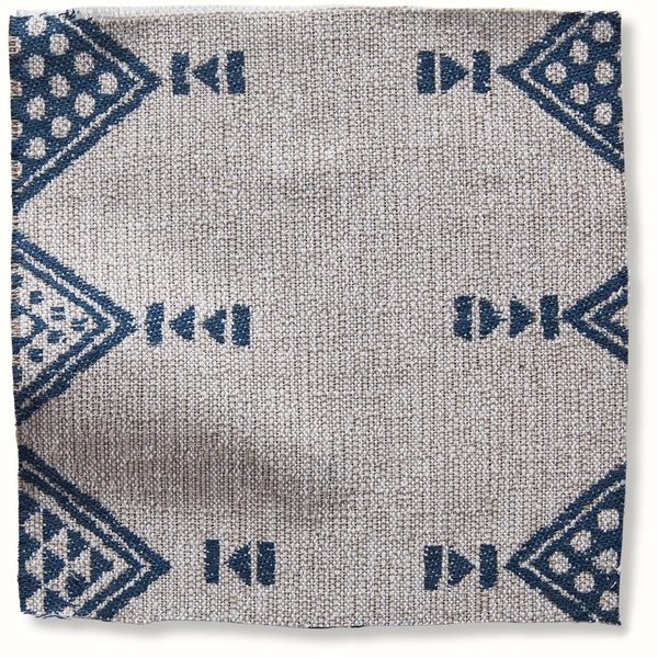 Outdoor Mombasa pillow in natural fabric with blue geometric border pattern