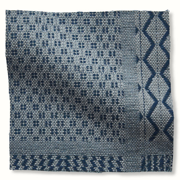 Outdoor Nawab pillow cover in blue with textured pattern and diamond border detail
