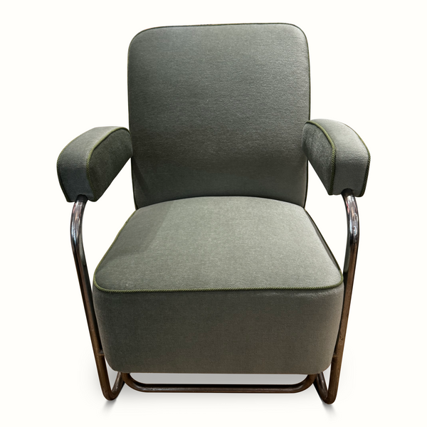 Dark fabric reclining chair with padded arms, chrome base, and contrast green piping