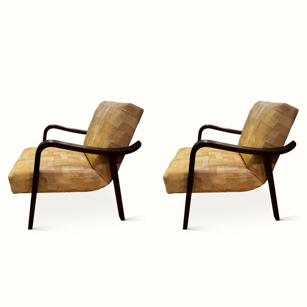 Patchwork leather accent chair, tan quilted cushions and dark wood arm frame, side view