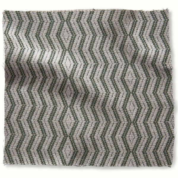Outdoor decorative pillow with green zigzag pattern on natural fabric