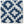 Indigo outdoor pillow cover with repeating white geometric flower pattern