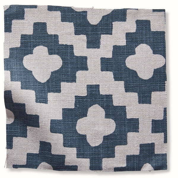 Indigo and white geometric pillow cover with star-like pattern