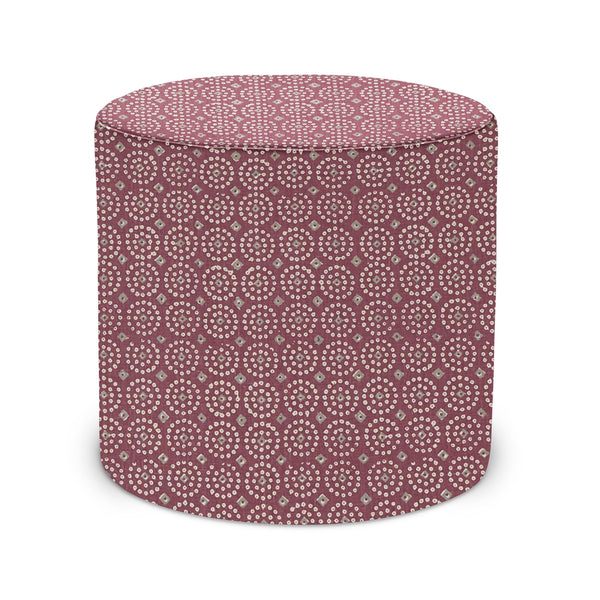 Indoor pouf ottoman with round cylinder shape, maroon fabric with white geometric pattern