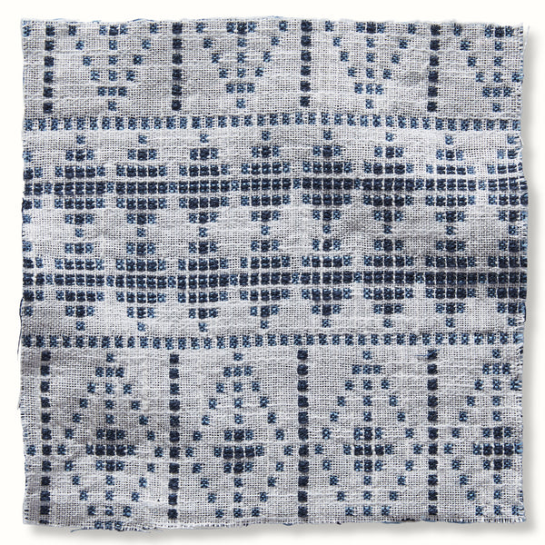 Outdoor souk pillow cover in indigo and midnight blue, woven geometric pattern