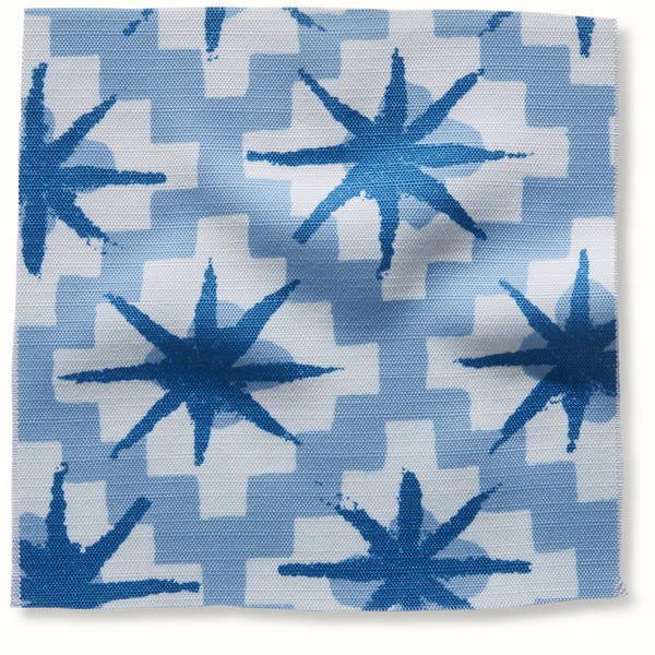 Outdoor starburst pillow cover with indigo and sky blue burst pattern