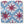 Outdoor pillow cover with blue geometric pattern and red starburst motifs