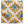 Starburst patterned pillow cover in white, yellow, and blue with star flower motifs