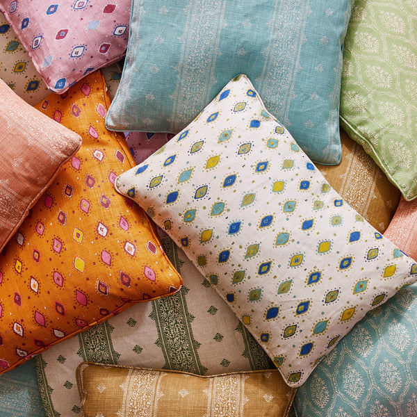 A pile of colorful pillows in different patterns.