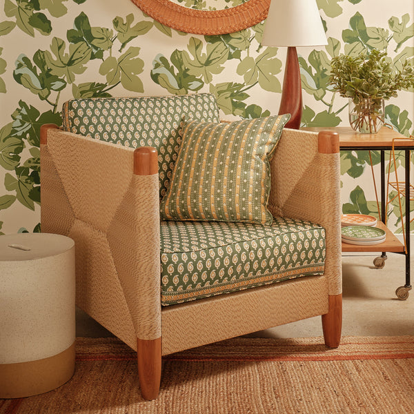 Green and gold patterned outdoor pillow, square shape