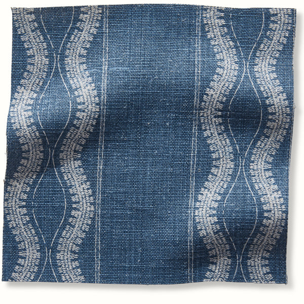 Indigo patterned pillow cover with circular line motif and vertical grid stripes