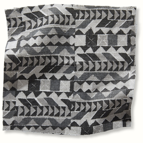 Charcoal/gray geometric pillow cover with arrow, triangle, and chevron pattern