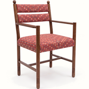 Upholstered armchair with red patterned fabric cushion, light walnut wooden arms and legs