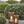 Saddle brown stitched leather lanterns with glass sides and lit candles