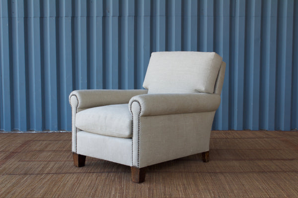 The Vista Upholstered Armchair, designed by Hollywood at Home founder Peter Dunham, is an updated take on the classic club chair. It's made by hand in Los Angeles with a rounded arm with brass nailhead detail and a deep, comfortable seat.