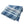 Folded deep indigo and ivory striped bedcover with geometric blocks and stitched bands