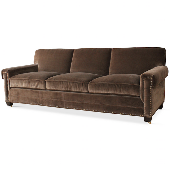 A customizable sofa with nailhead detail, designed by Peter Dunham for hollywood at Home, handmade in Los Angeles.